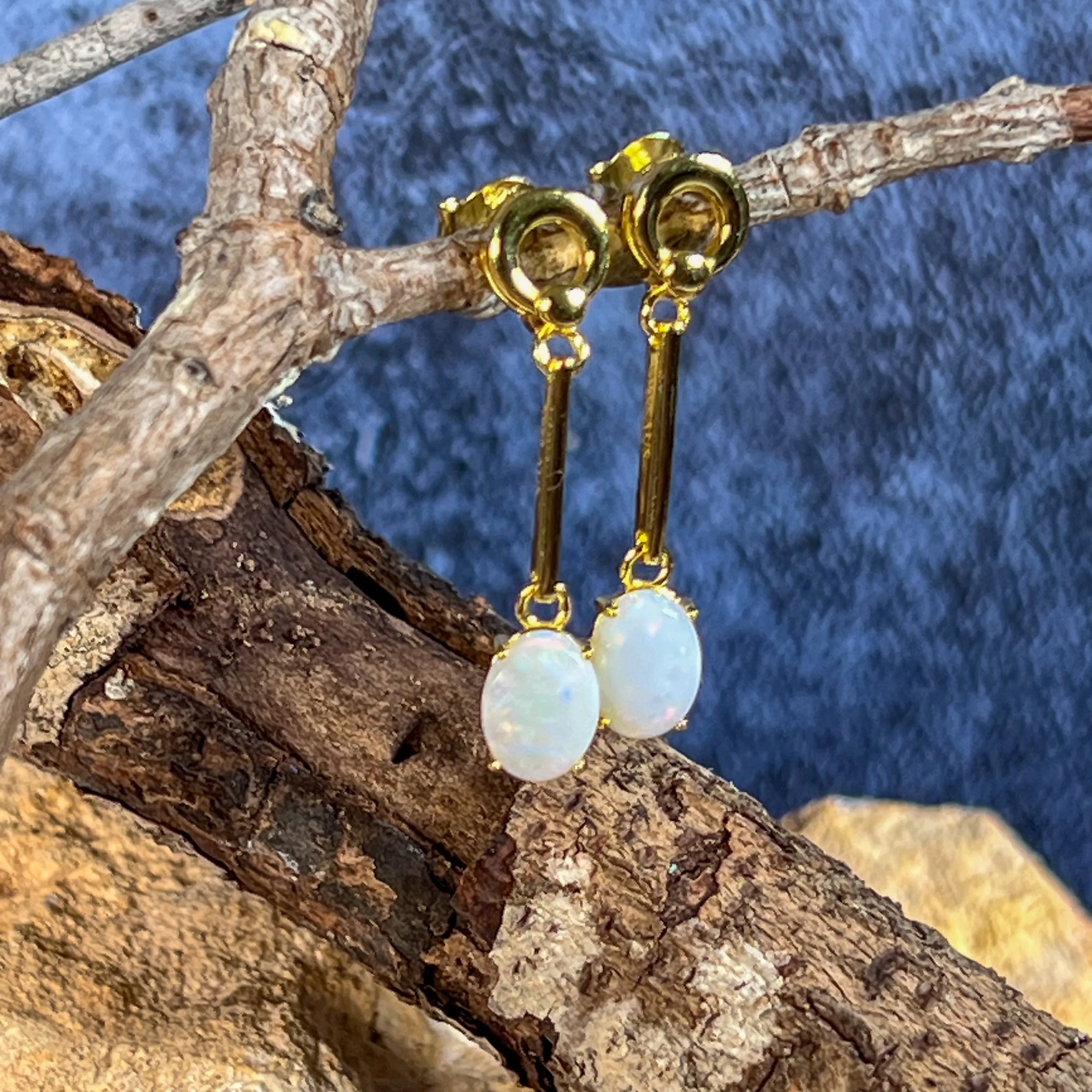 Gold plated silver White Opal earrings dangling claw set 8x6mm