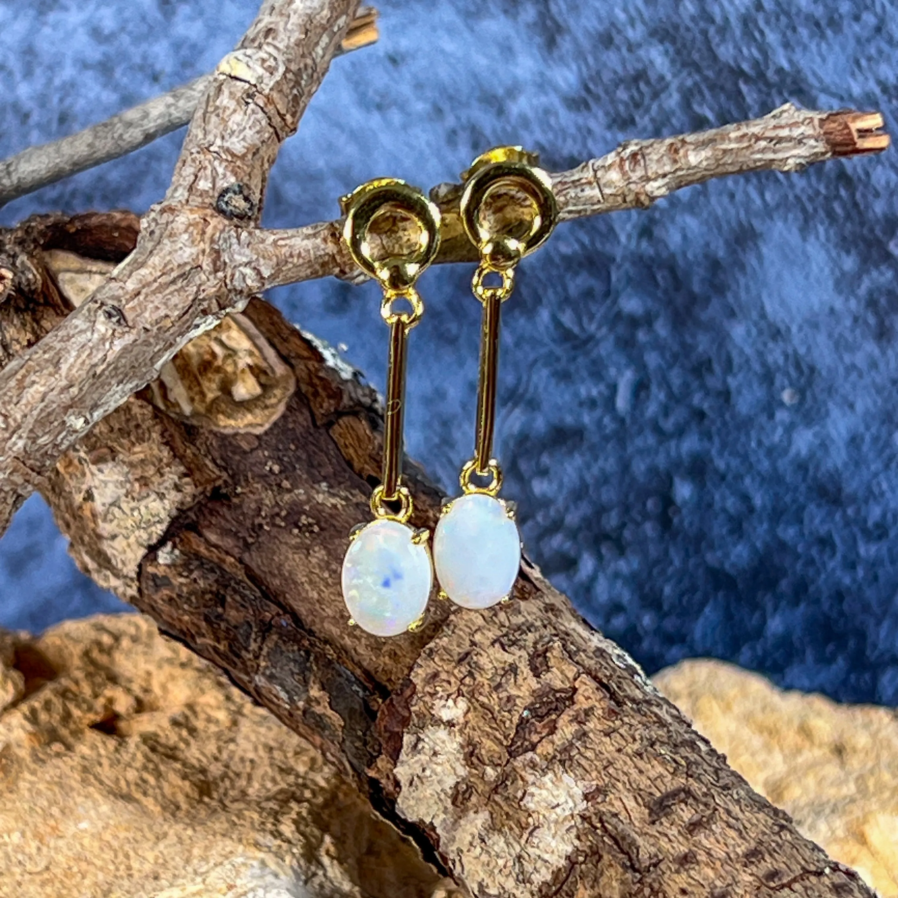 Gold plated silver White Opal earrings dangling claw set 8x6mm