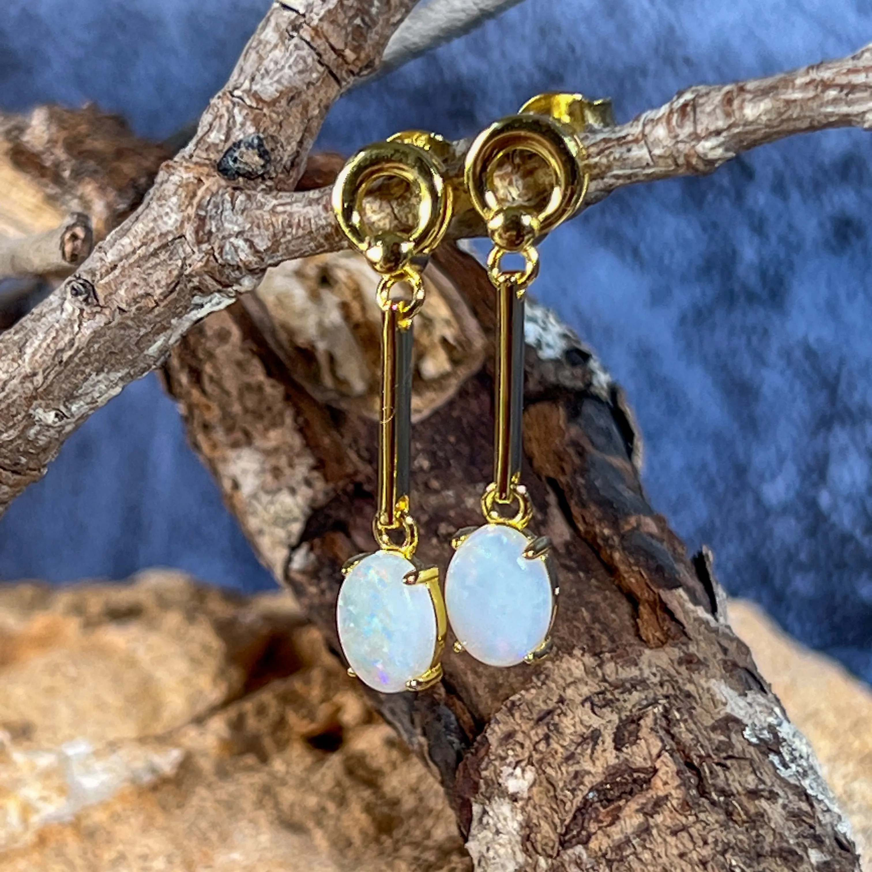 Gold plated silver White Opal earrings dangling claw set 8x6mm