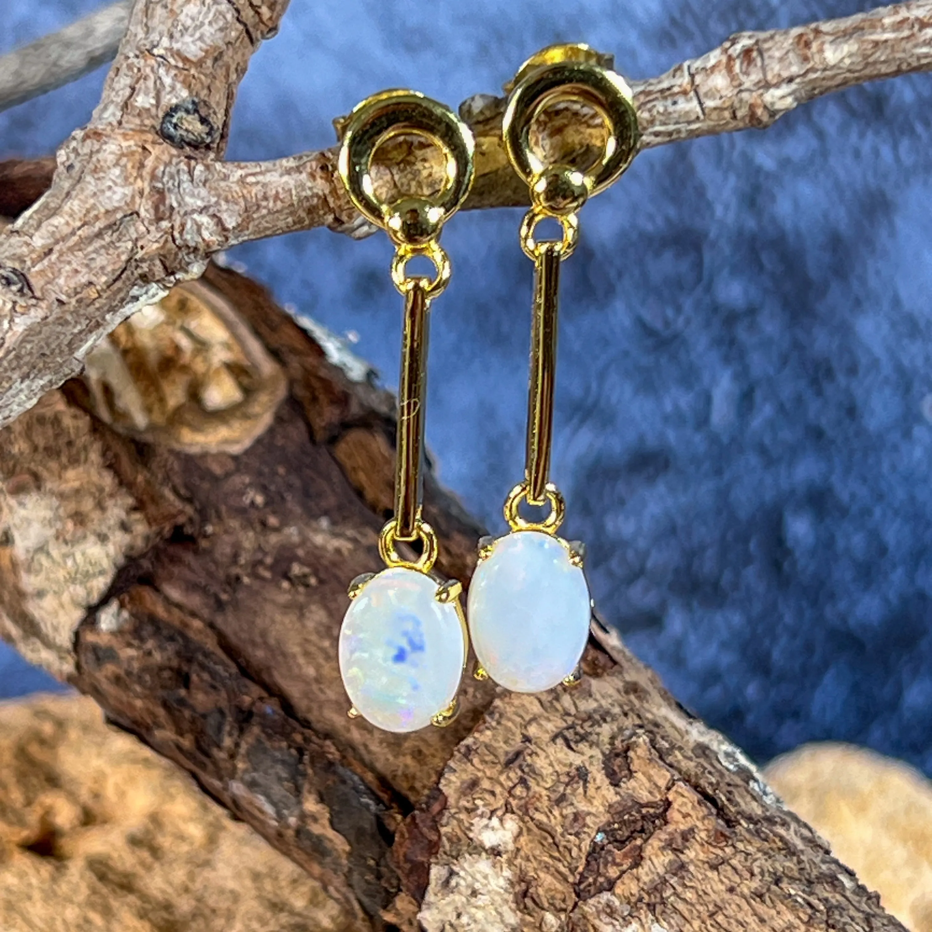 Gold plated silver White Opal earrings dangling claw set 8x6mm